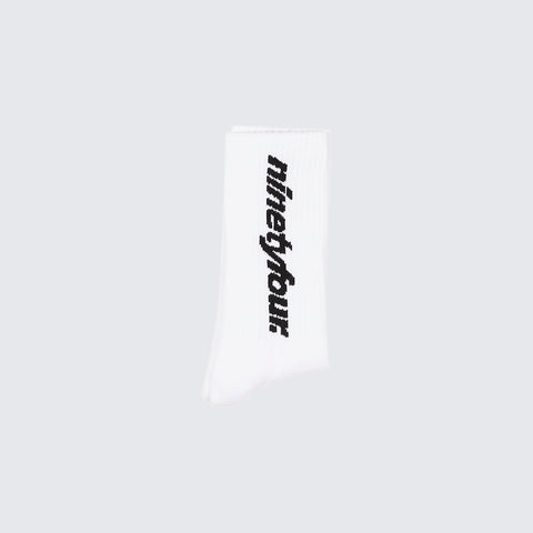 The DEBUT SOCKS in WHITE, a perfect blend of comfort and style. Crafted from high-quality materials, these socks feature our distinctive black Fundamentals logo.