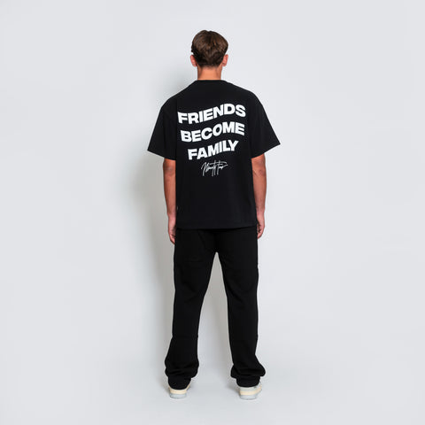 The FBF STUDIOS T-SHIRT, crafted from premium-grade black cotton jersey. Our signature quote, 'Friends Become Family', adorns the back, symbolizing the bonds that unite us.