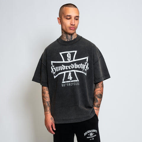 The Hundredboyz SHIELD T-SHIRT, meticulously crafted from premium-grade cotton jersey for exceptional comfort and durability. This shirt showcases a logo with the words 'HUNDREDBOYZ', flanked by a dynamic number '94' and a bold shield.