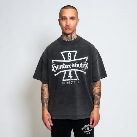 The Hundredboyz SHIELD T-SHIRT, meticulously crafted from premium-grade cotton jersey for exceptional comfort and durability. This shirt showcases a logo with the words 'HUNDREDBOYZ', flanked by a dynamic number '94' and a bold shield.